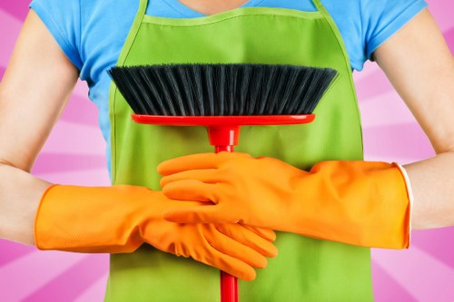 Office cleaners working in a London office reception area