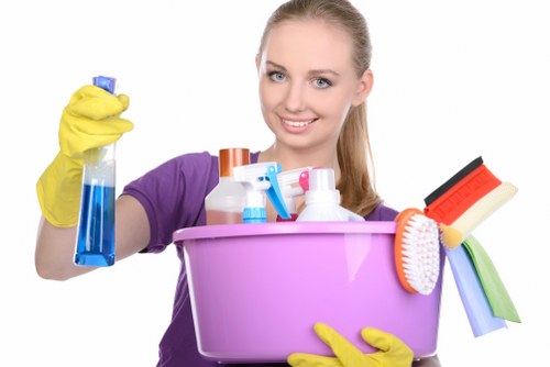 Cleaner preparing a bathroom in a London home