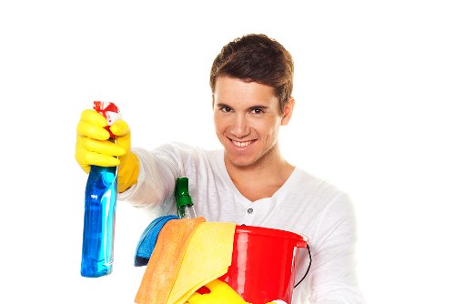 Cleaner treating dining chairs during upholstery cleaning in London