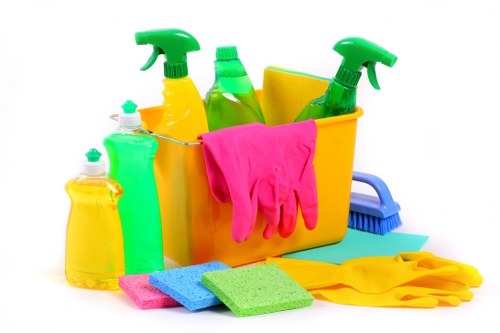 Staff member wearing PPE while carrying out professional cleaning duties